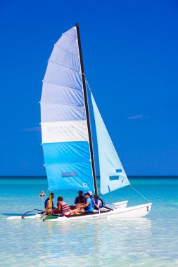 Tourists sailing in a catamaran in Cuba clipart