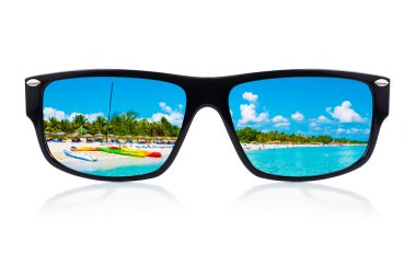 Sunglasses with reflections of a tropical beach clipart