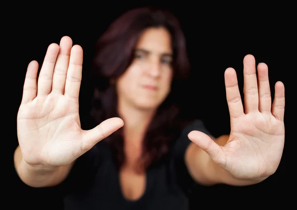 Mujer con las manos señalando para parar — Foto de Stock