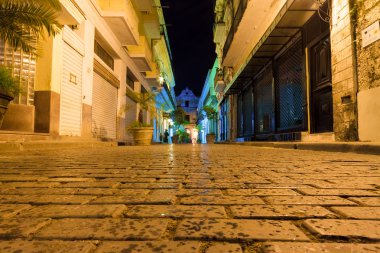 Narrow street at night in Old Havana clipart