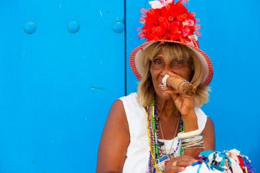 Colorful old black lady with a fine cuban cigar clipart