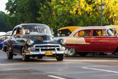 Beautiful vintage Chevrolet on the streets of Havana clipart