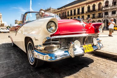 Vintage Ford Fairlane in front of the Capitol in Havana clipart