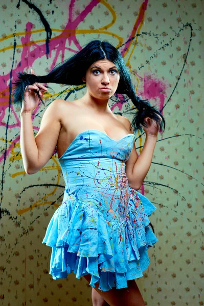 Surprised looking nice girl in blue dress — Stock Photo, Image