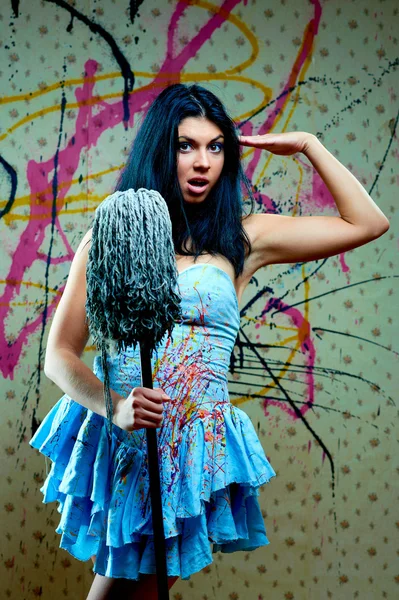 Attractive girl with a mop — Stock Photo, Image