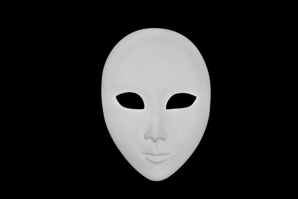 White face mask isolated over black