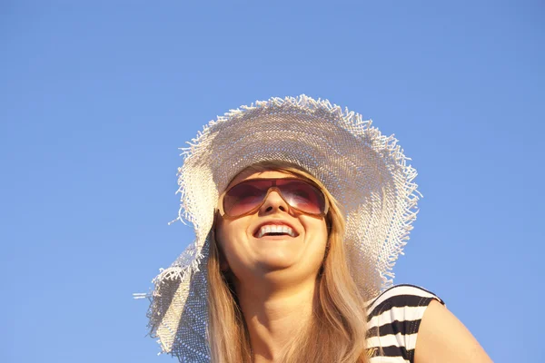 Young laughing blonde woman with white hat — Stock Photo, Image