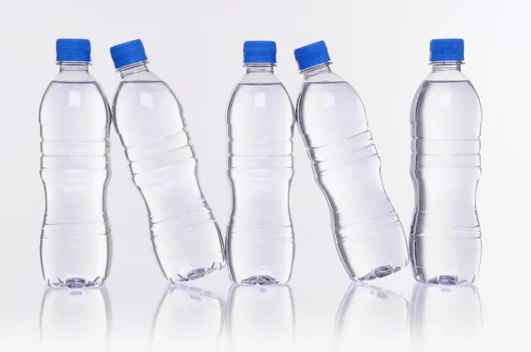 Water bottles reflection Royalty Free Stock Images