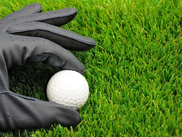 Bola de golfe e luva — Fotografia de Stock