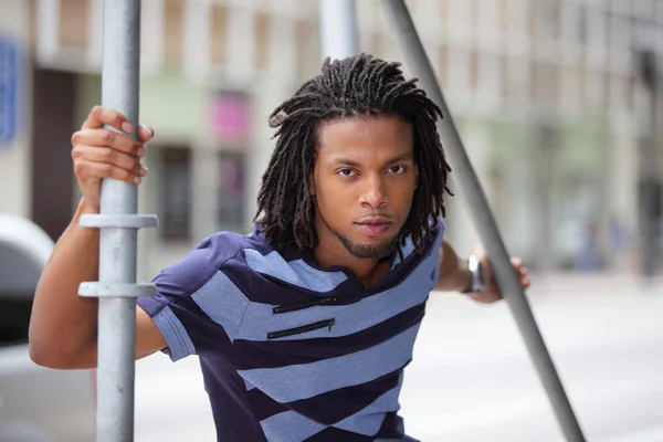 Male model posing by scaffolding — Stock Photo, Image