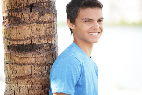 Young male by the tree — Stock Photo, Image