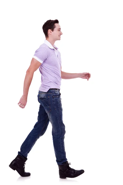 Side view of a fashion man walking forward — Stock Photo, Image