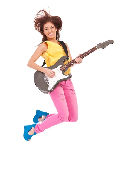 Passionate woman guitarist jumps in the air — Stock Photo, Image