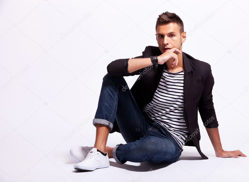 Cool fashion male model sitting