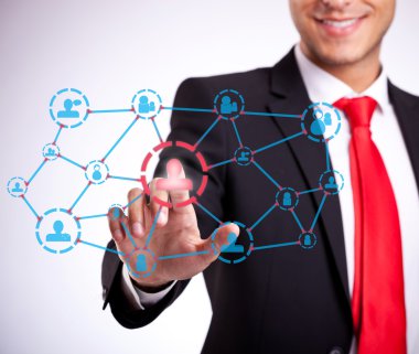 Businessman pressing social network buttons clipart