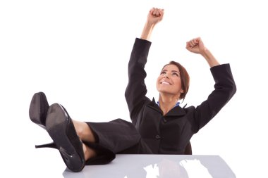 Relaxed and winning business woman sitting clipart