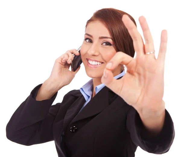 Business woman with phone and ok gesture — Stock Photo, Image