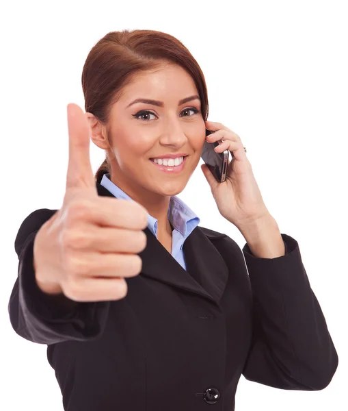 Woman with phone and thumbs up gesture — Stock Photo, Image