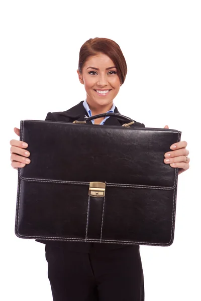 Business woman handing a suit case to you — Stock Photo, Image