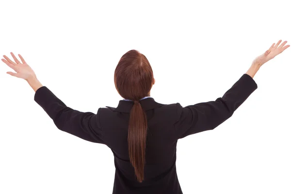 Back of a business woman holding her hands up — Stock Photo, Image