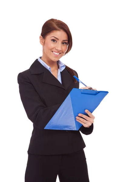 Smiling business woman with blue clipboard — Stock Photo, Image