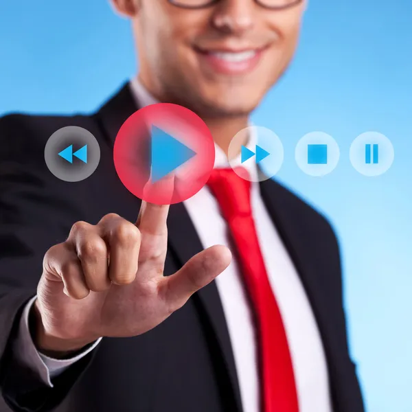 Business man pushing a play button — Stock Photo, Image