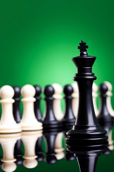 Black king standing in front of all the pawns — Stock Photo, Image
