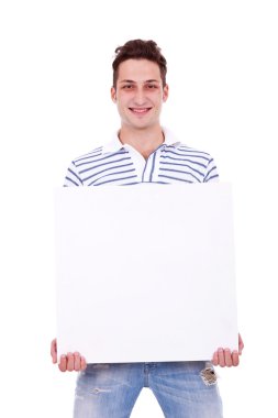 Casual man holding white sign to write it on your text clipart