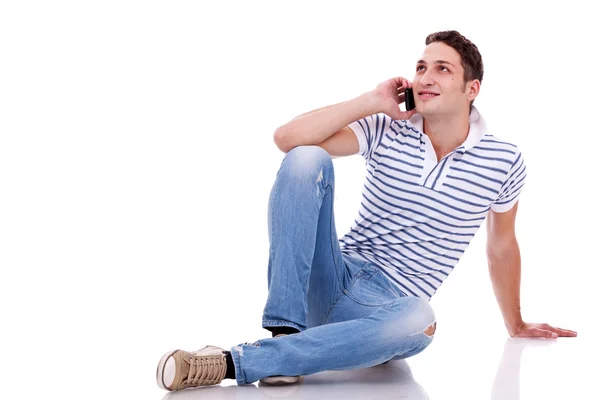 Young casual man talking on the phone — Stock Photo, Image