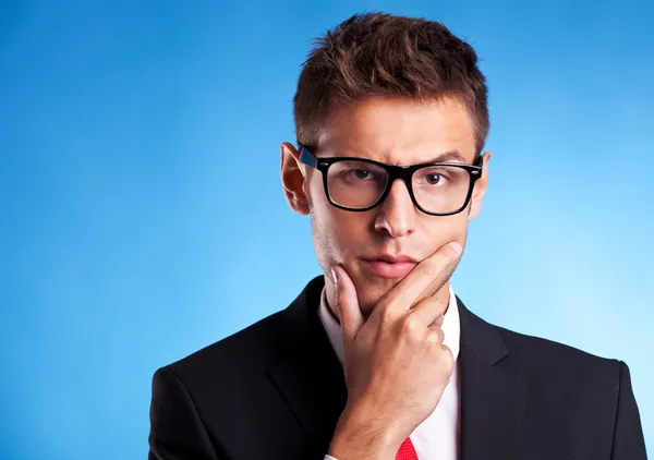 Pensive young business man — Stock Photo, Image