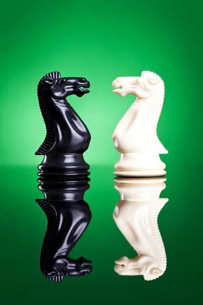 White and black knights facing aeach other — Stock Photo, Image