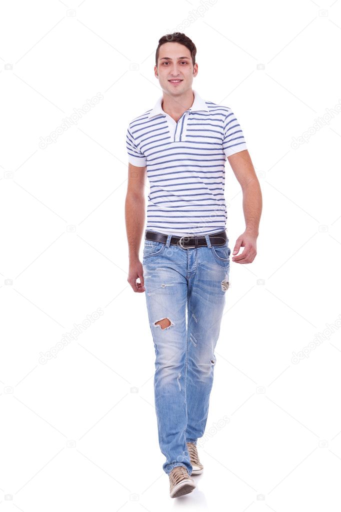 Casual Man is walking towards the camera