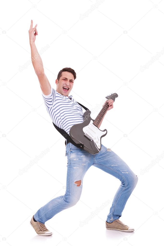 Young casual man playing an electric guitar