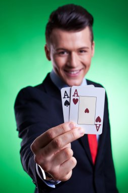 Business man holding a pair of aces clipart