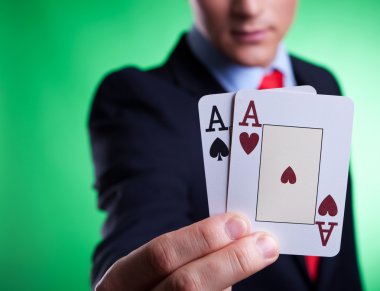 Business man holding a pair of aces clipart