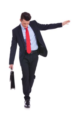 Business man with slow walking with fear from falling clipart