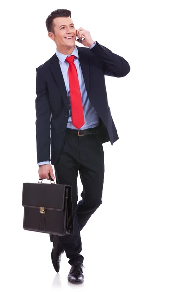 Business man with briefcase talking on the phone — Stock Photo, Image