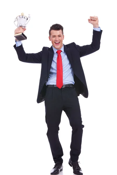 Business man holding a gold trophy — Stock Photo, Image