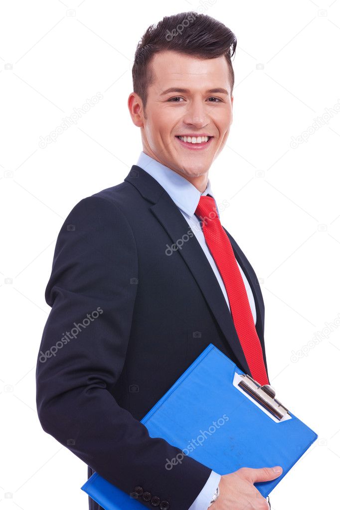 Businessman holding blank clipboard