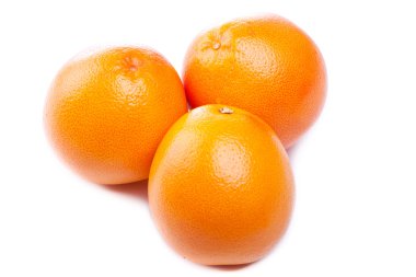 Three fresh grapefruits