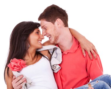 Young man holding his love in his arms and smiling clipart