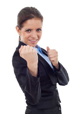 Young business woman in fighting position clipart