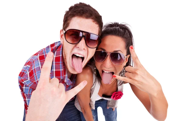 Party couple screaming with tongues out — Stock Photo, Image