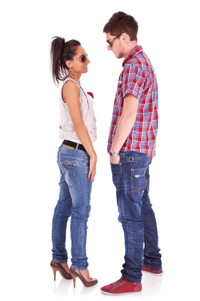 Cute casual couple standing face to face — Stock Photo, Image