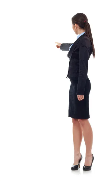 Joven mujer de negocios señalando con su mano derecha — Foto de Stock