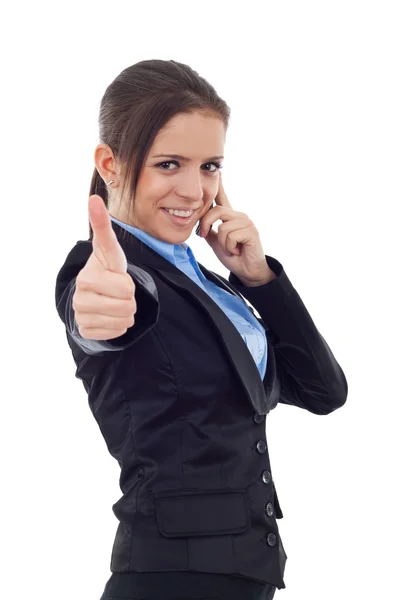 Young business woman with thumbs up sign and speaking at phone — Stock Photo, Image