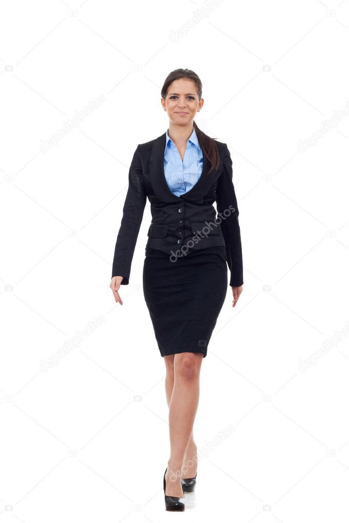 Young business woman walking towards camera