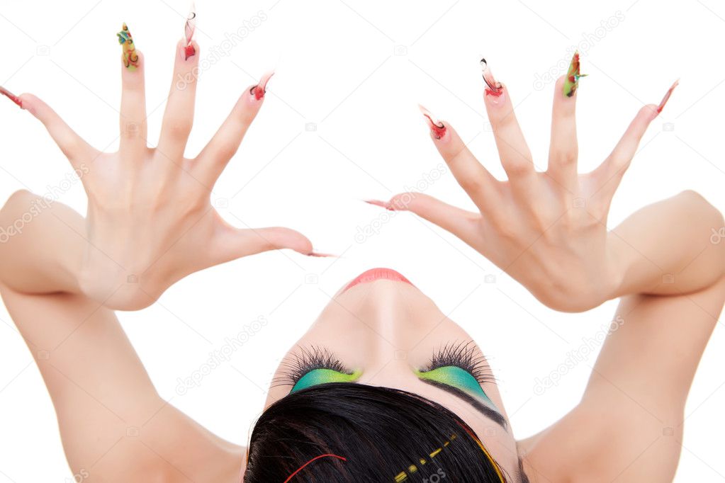 Top-view of a young woman model showing nails