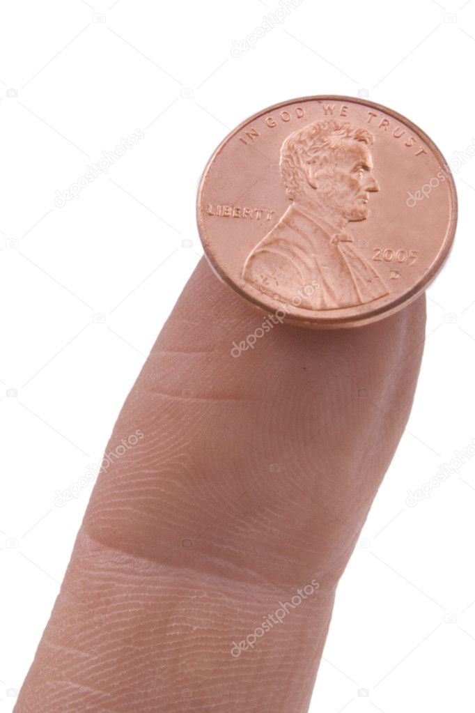 Penny balanced on a finger