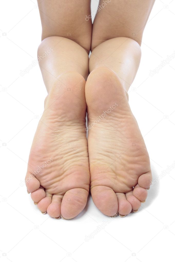 Female feet over white background